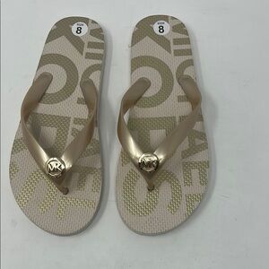 NWOT Michael Kors Gold Cream Flip Flops with Metallic Accents